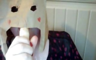 Horny whore with a fat ass in mask sucks a banana in homemade porn